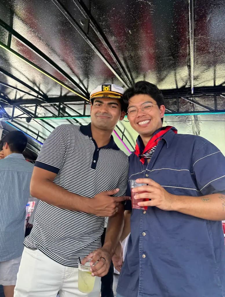 Lapo at a party wearing a captain's hat with drinks